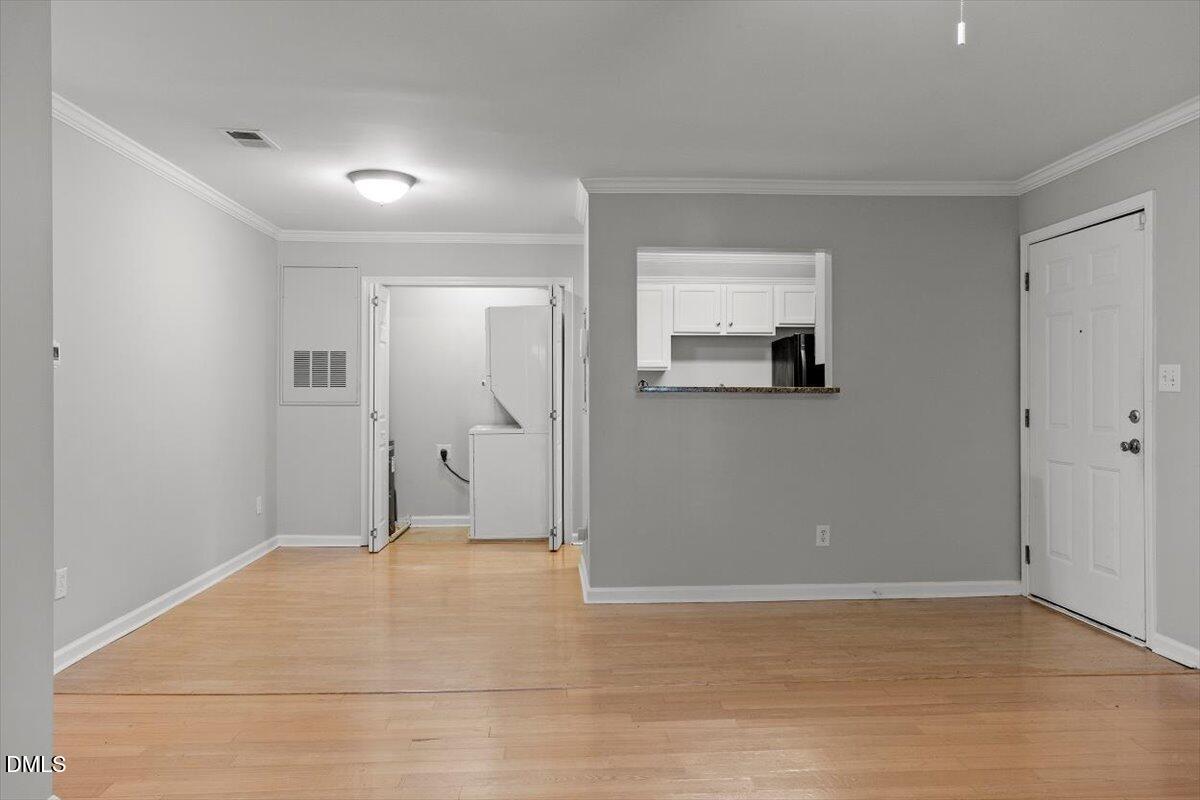 2308 Myron Drive, Unit 201 Raleigh, NC 27607 - Photo 6 of 29 wooden floor in a room with a mirror