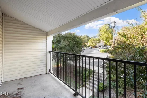 a view of a balcony with wooden floor