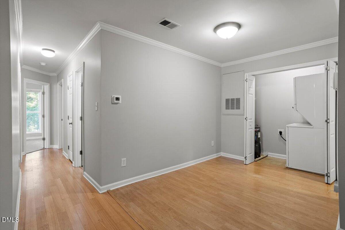 2308 Myron Drive, Unit 201 Raleigh, NC 27607 - Photo 9 of 29 wooden floor in an empty room with a window