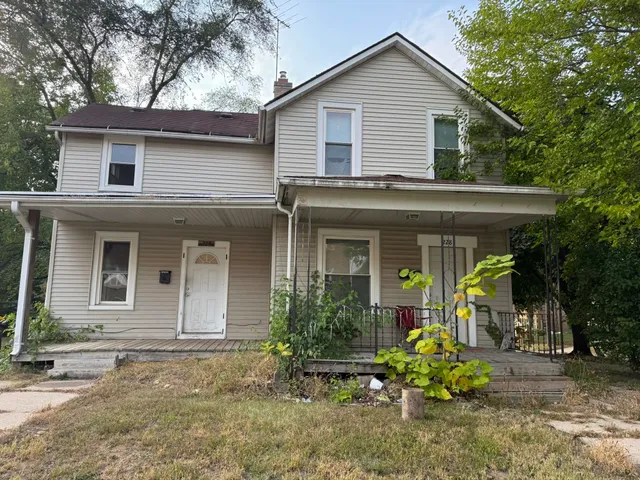 a front view of a house with a porch