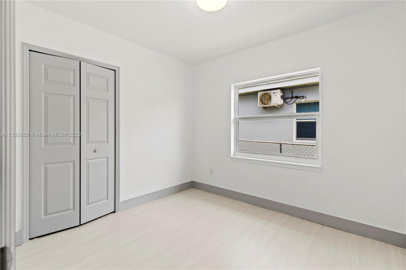 Pinewood Miami, FL 33150 - Photo 14 of 20 a view of an empty room with a window