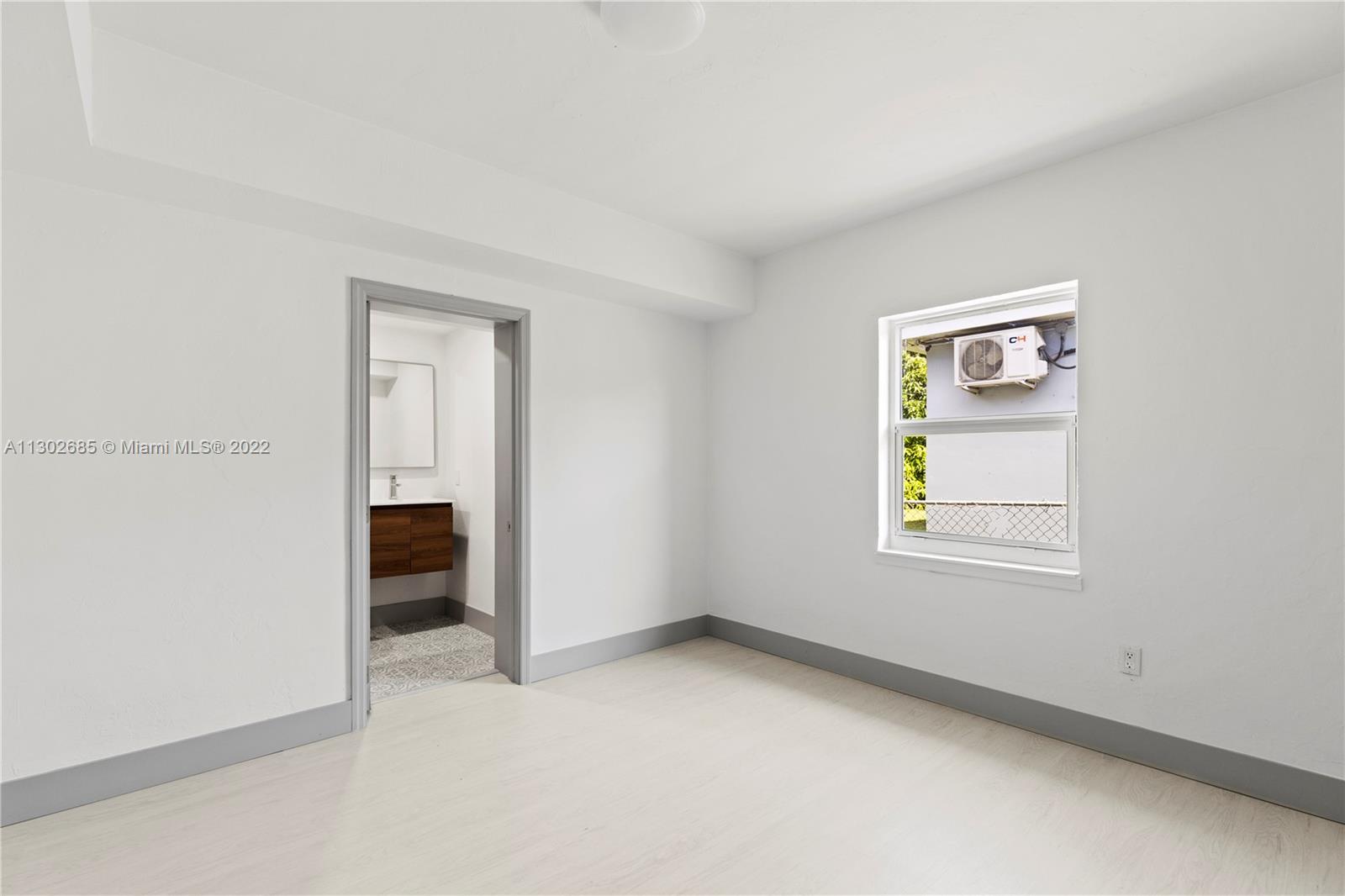 Pinewood Miami, FL 33150 - Photo 16 of 20 an empty room with windows