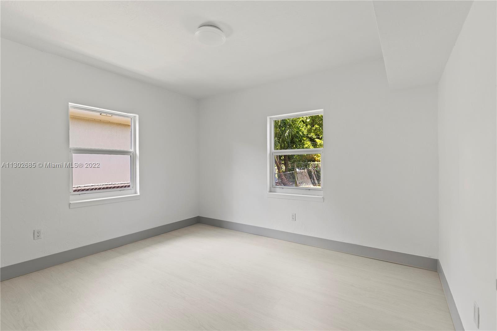 Pinewood Miami, FL 33150 - Photo 7 of 20 an empty room with windows