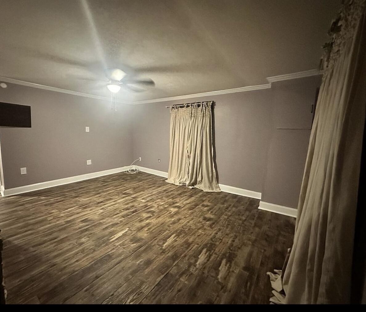 120 7th Street Calhoun, TN 37309 - Photo 3 of 17 a view of empty room with wooden floor