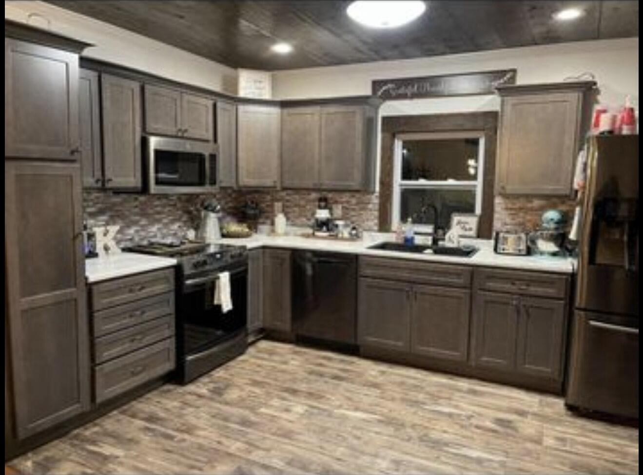 120 7th Street Calhoun, TN 37309 - Photo 6 of 17 a kitchen with a sink stove and refrigerator