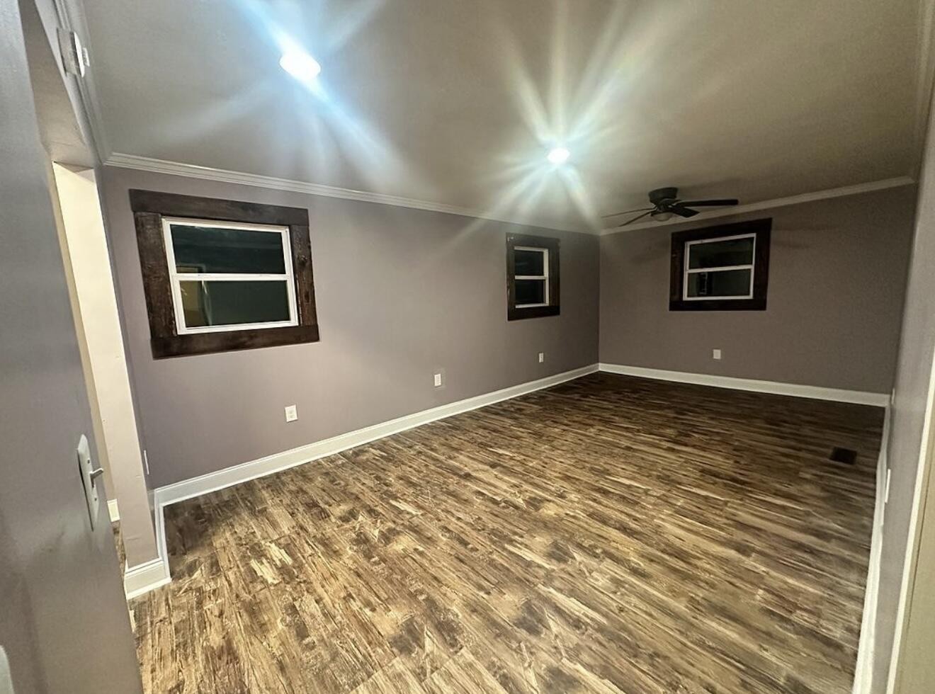 120 7th Street Calhoun, TN 37309 - Photo 9 of 17 a view of an empty room with wooden floor and a window