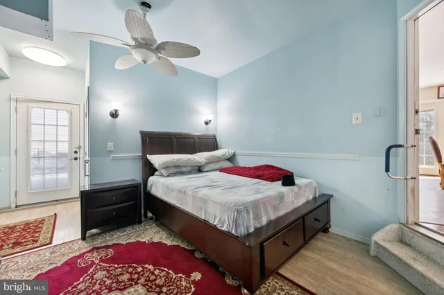 a bedroom with a bed and dresser