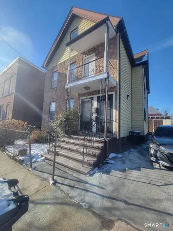 a view of house with a street