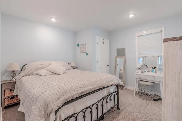 a bedroom with a bed and a cabinets