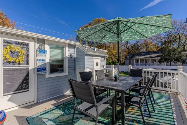 a view of a dinning table and chairs in the patio