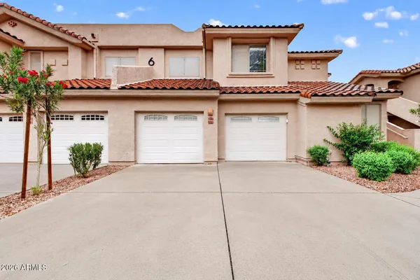 a front view of a house with yard