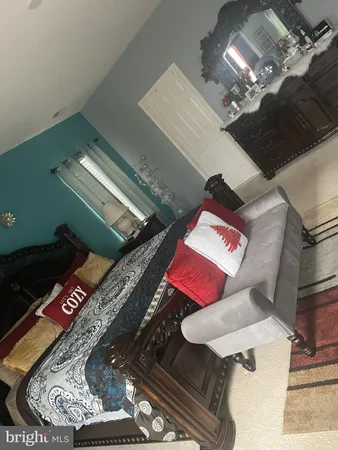 a living room with furniture and rug