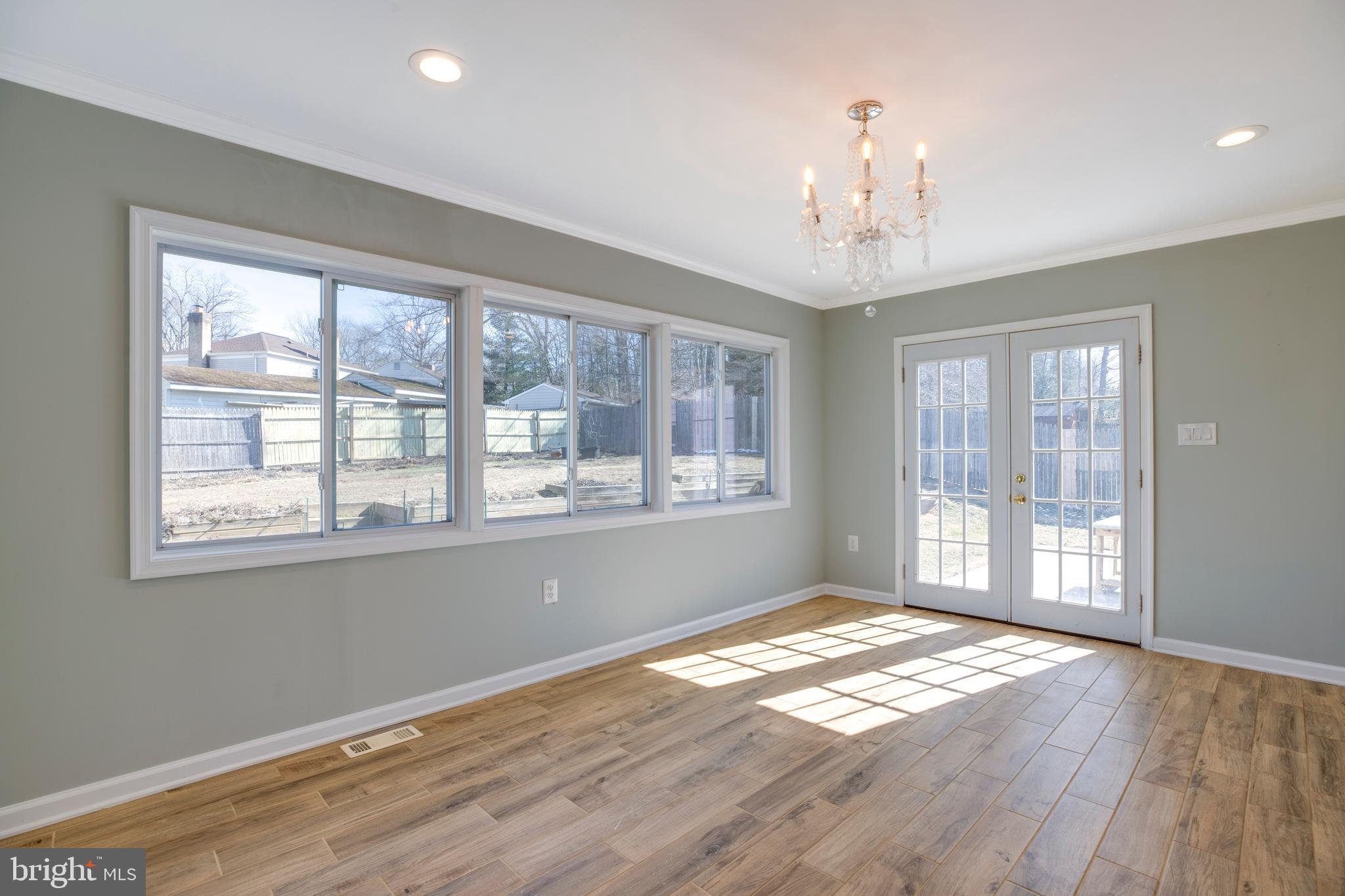 11905 Basswood Drive Laurel, MD 20708 - Photo 17 of 51 a view of an empty room with wooden floor and a window