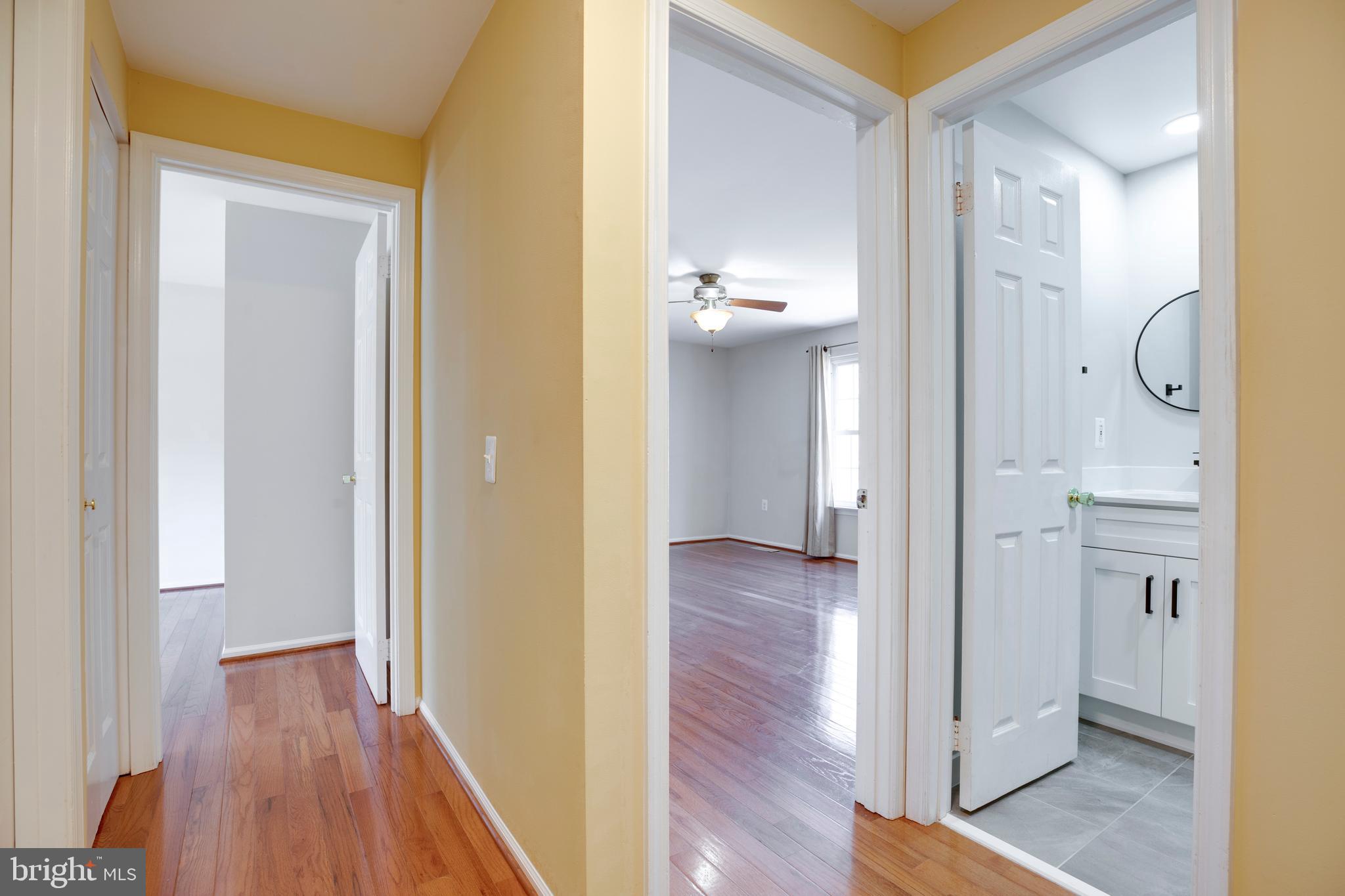 11905 Basswood Drive Laurel, MD 20708 - Photo 20 of 51 a view of a hallway with wooden floor