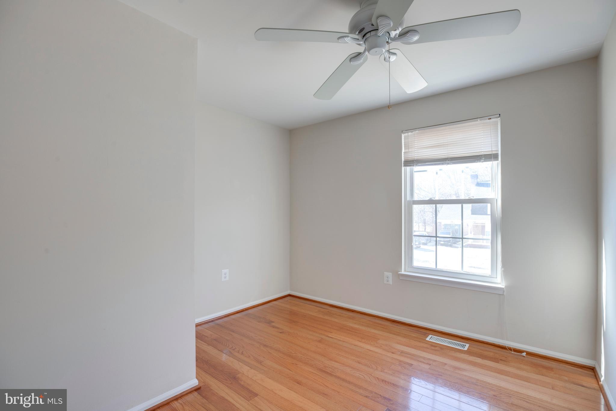 11905 Basswood Drive Laurel, MD 20708 - Photo 26 of 51 an empty room with a window and a fan