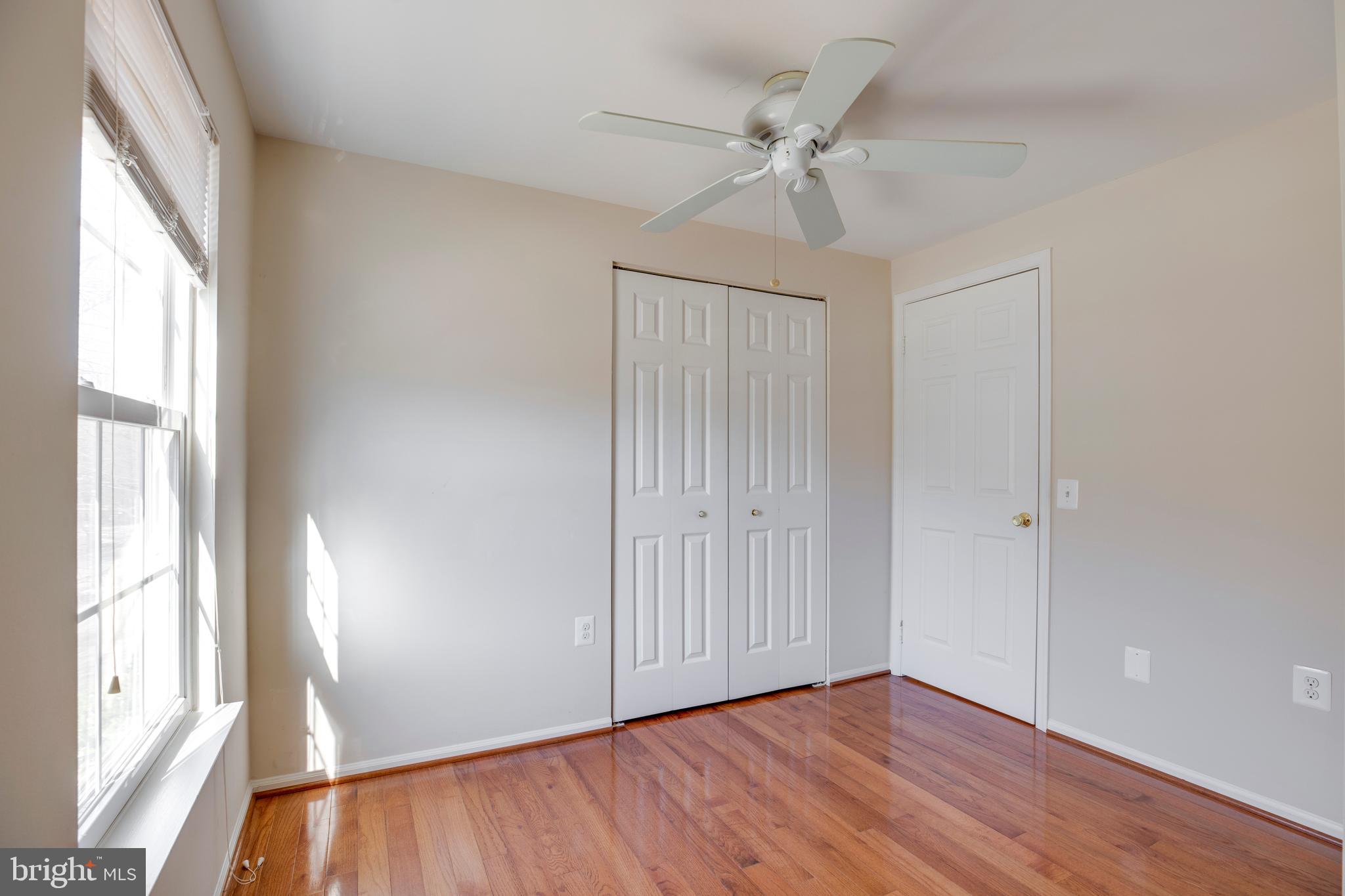 11905 Basswood Drive Laurel, MD 20708 - Photo 27 of 51 a view of an empty room with wooden floor and a window