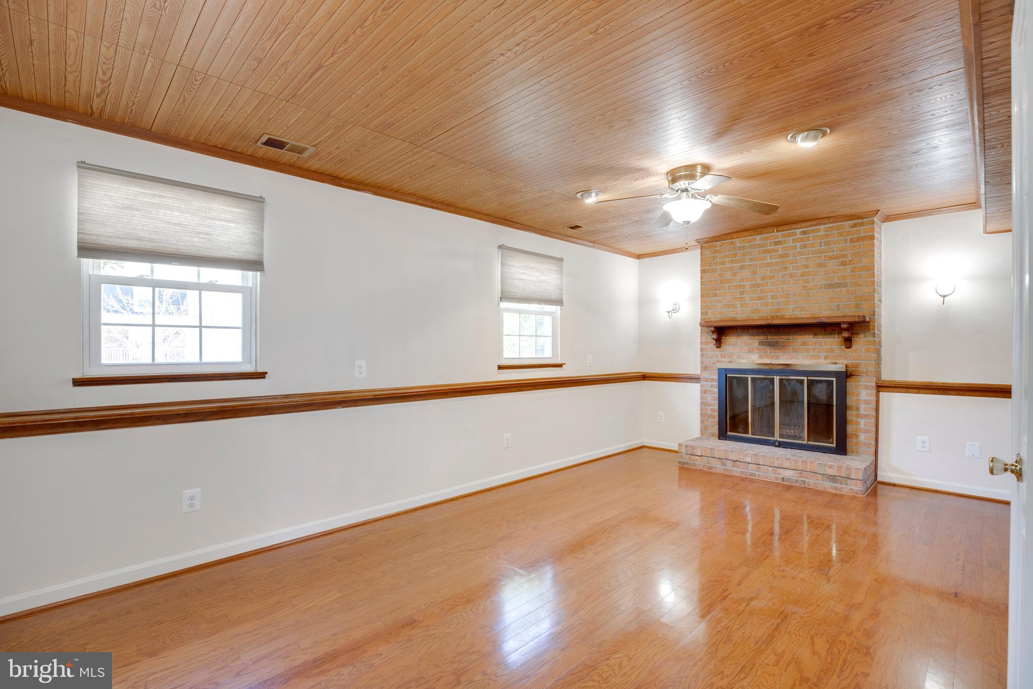 11905 Basswood Drive Laurel, MD 20708 - Photo 30 of 51 a view of a kitchen with stainless steel appliances wooden floor and a large window