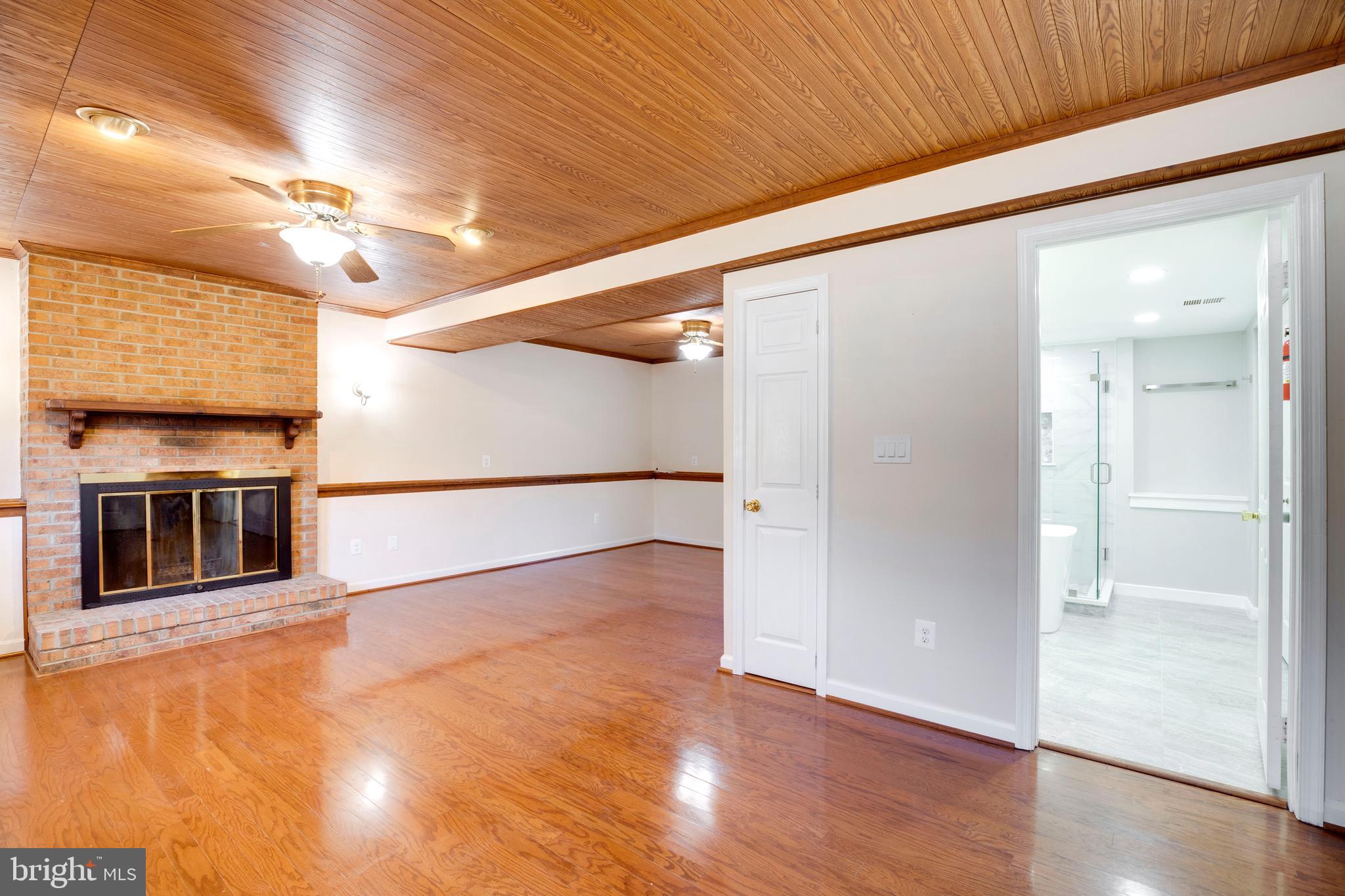 11905 Basswood Drive Laurel, MD 20708 - Photo 31 of 51 a view of a livingroom with an empty space and wooden floor