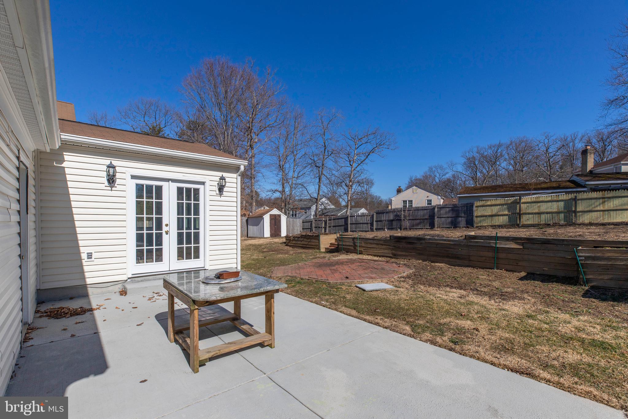 11905 Basswood Drive Laurel, MD 20708 - Photo 50 of 51 a building outdoor space with patio furniture and potted plants
