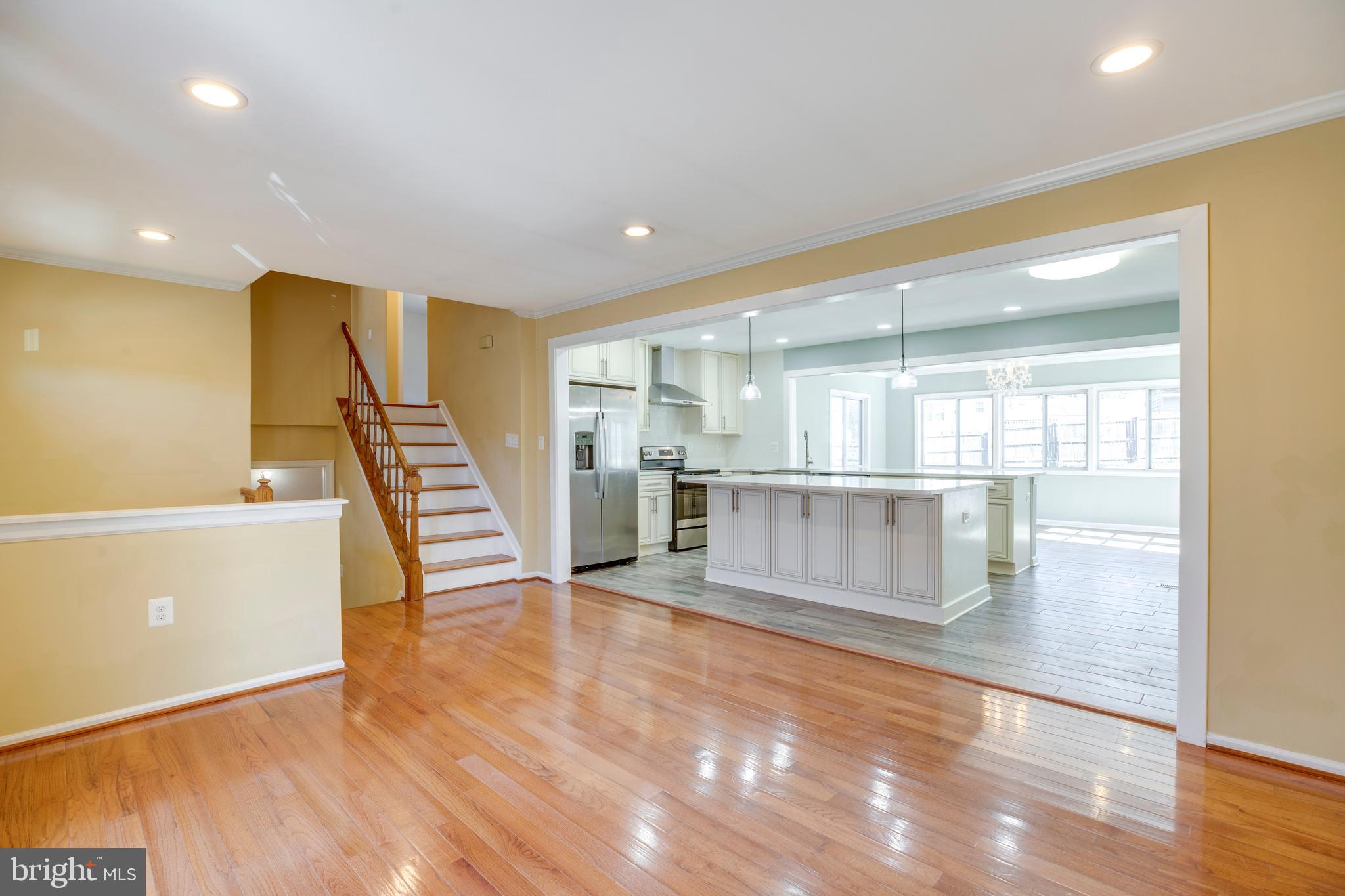 11905 Basswood Drive Laurel, MD 20708 - Photo 5 of 51 a view of an empty room with wooden floor