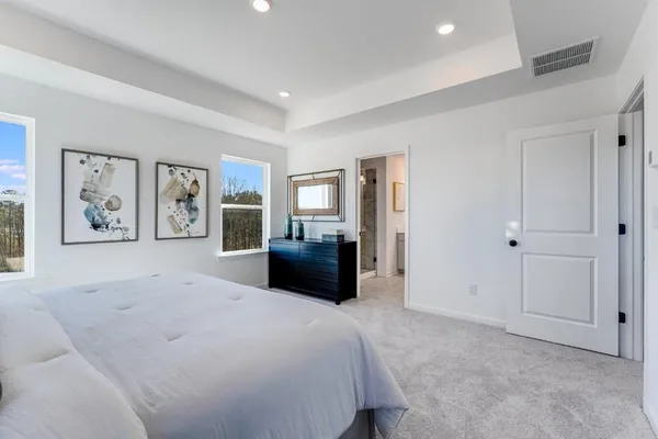 a bathroom with a double vanity sink mirror and shower
