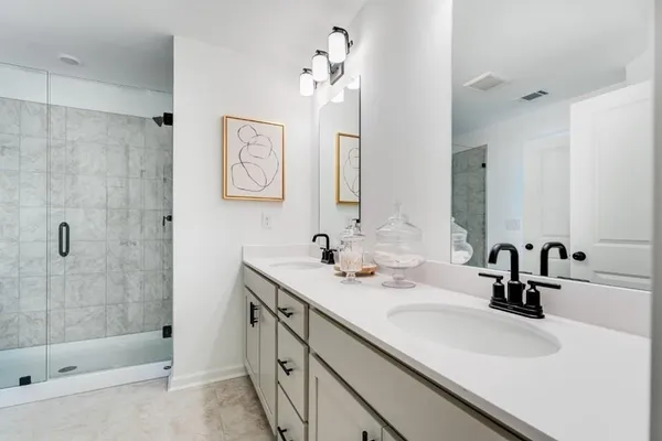 a bathroom with a sink toilet and a mirror