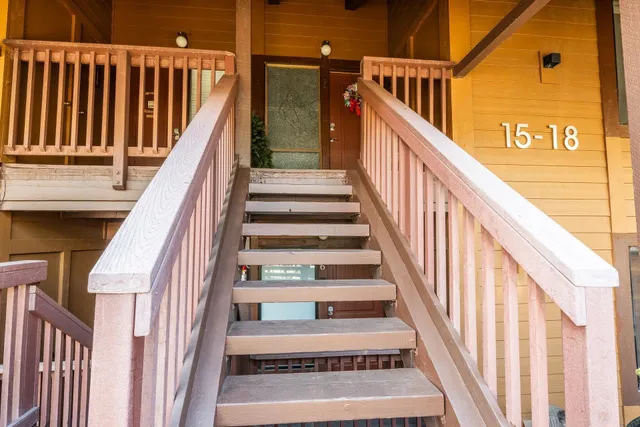a view of balcony with wooden floor and outdoor seating