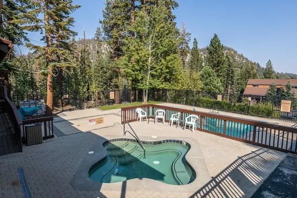 a view of a swimming pool with a patio