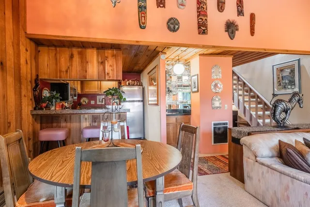 a dining table with chairs and a table