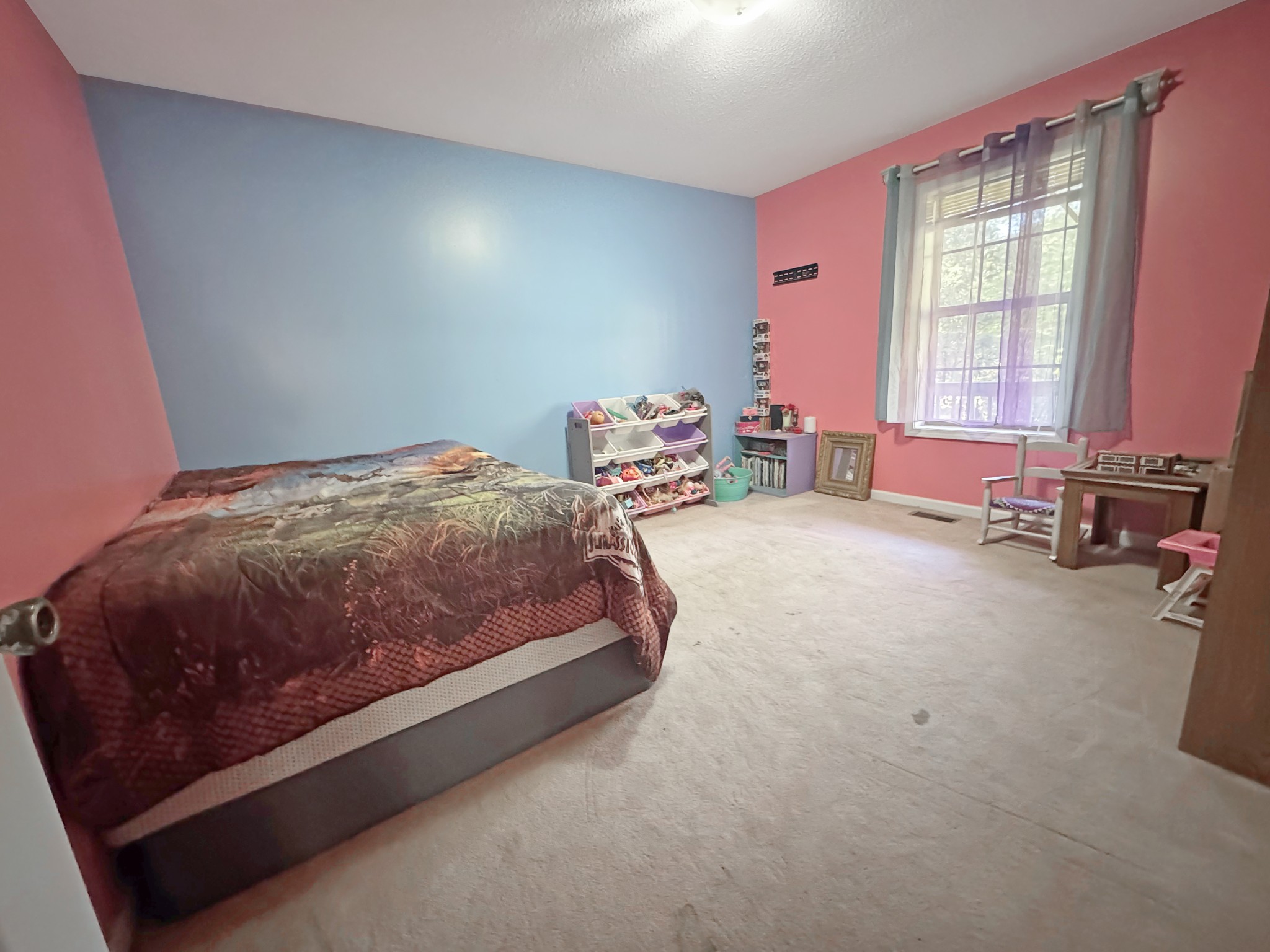 127 Lena Sykes Road Dover, TN 37058 - Photo 12 of 26 a bedroom with a bed and a window