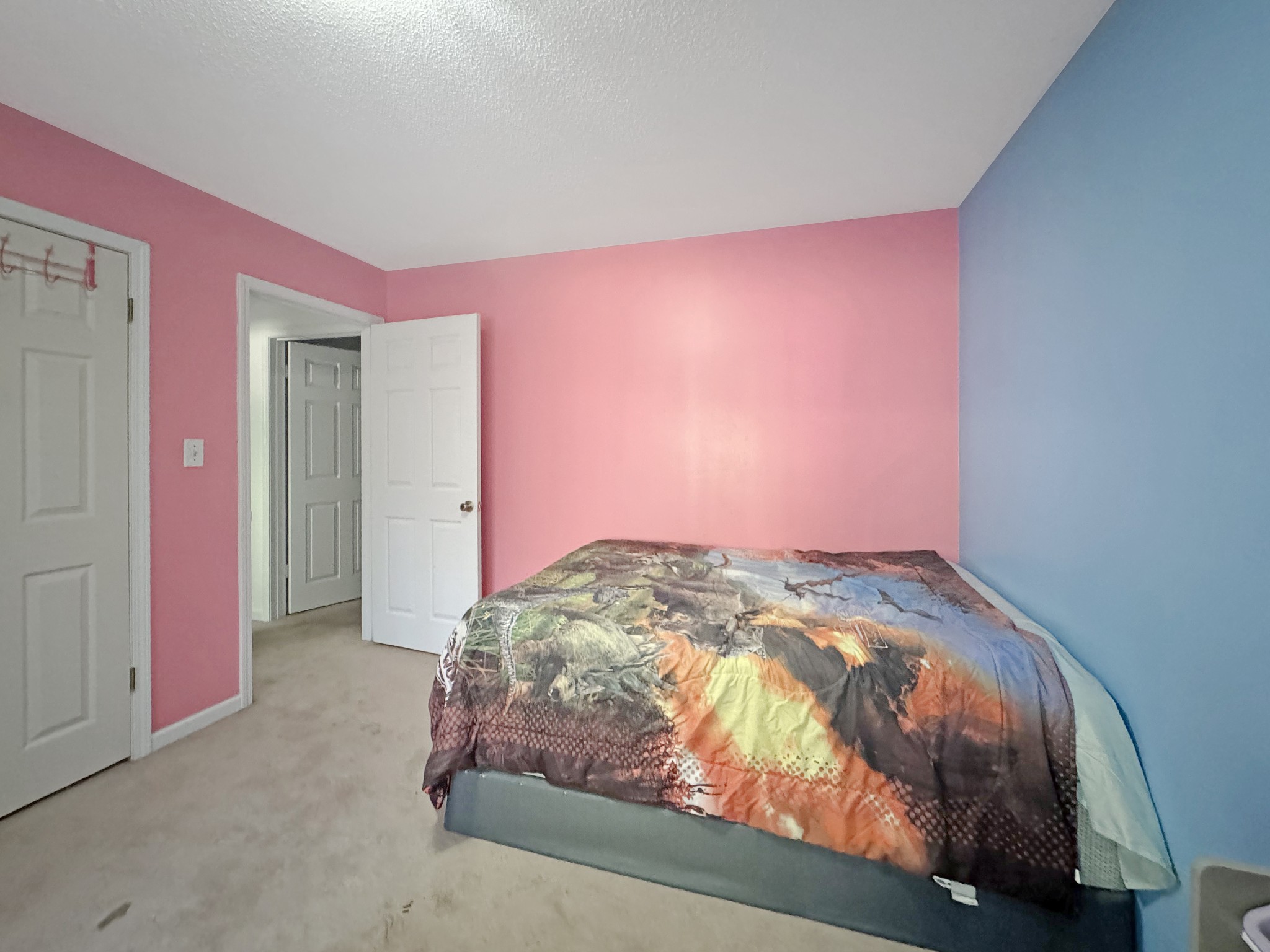 127 Lena Sykes Road Dover, TN 37058 - Photo 13 of 26 a bedroom with pink walls