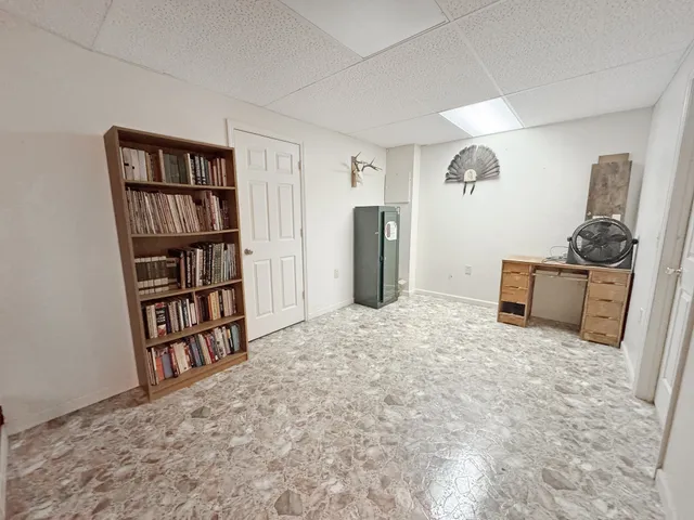 a view of a livingroom with furniture and closet