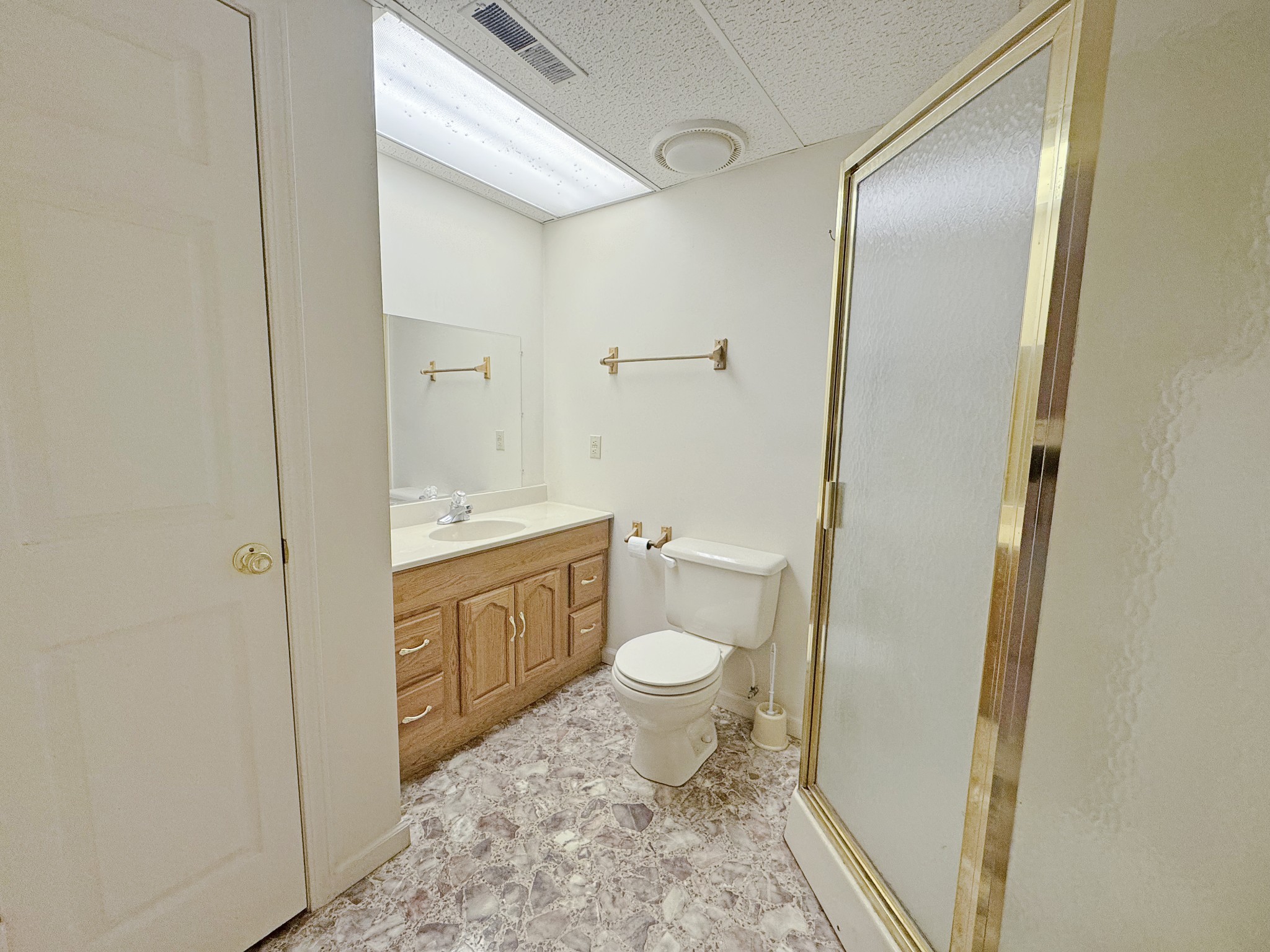 127 Lena Sykes Road Dover, TN 37058 - Photo 23 of 26 a bathroom with a granite countertop sink toilet and shower