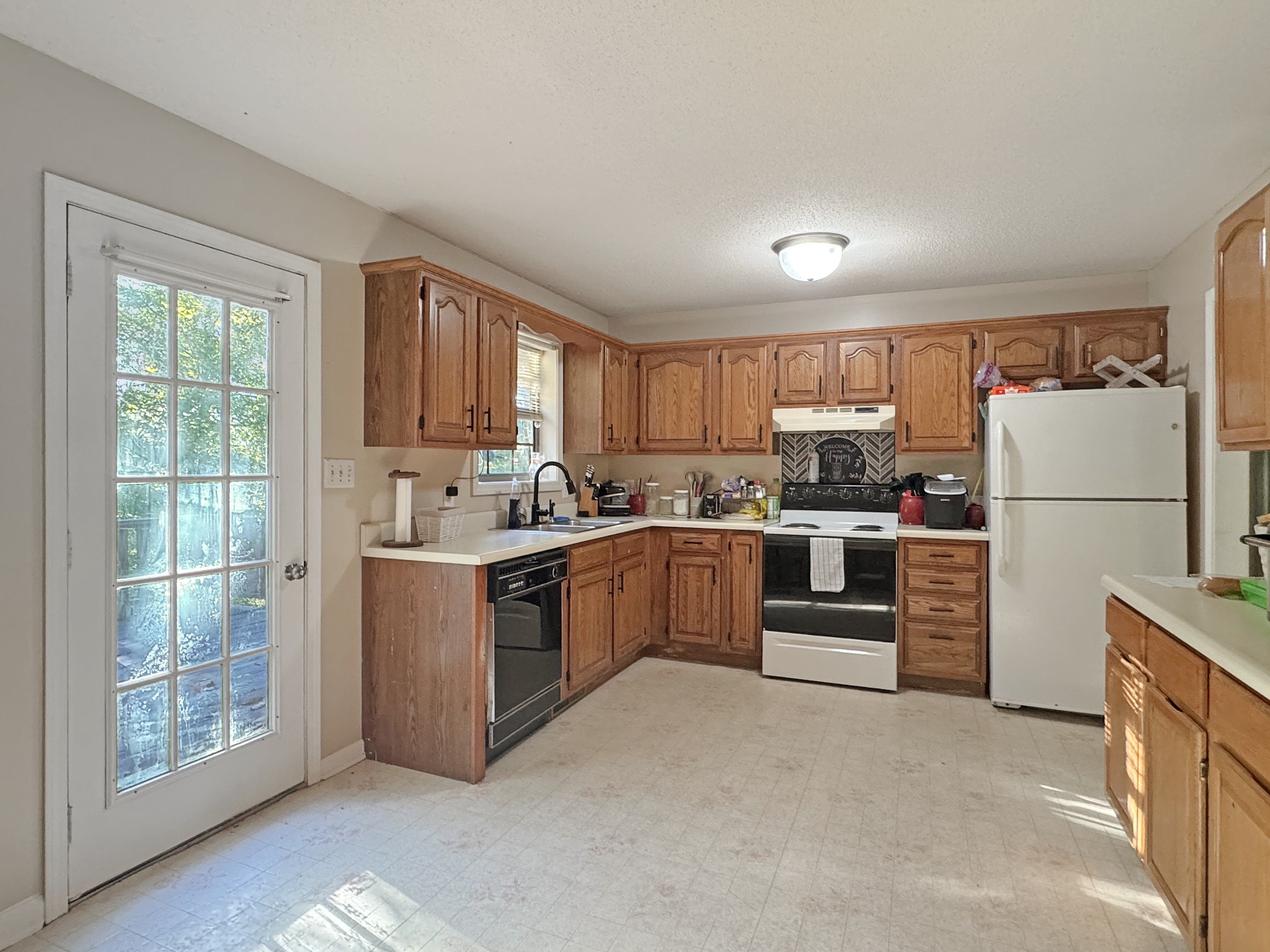 127 Lena Sykes Road Dover, TN 37058 - Photo 6 of 26 a kitchen with a refrigerator and a stove top oven