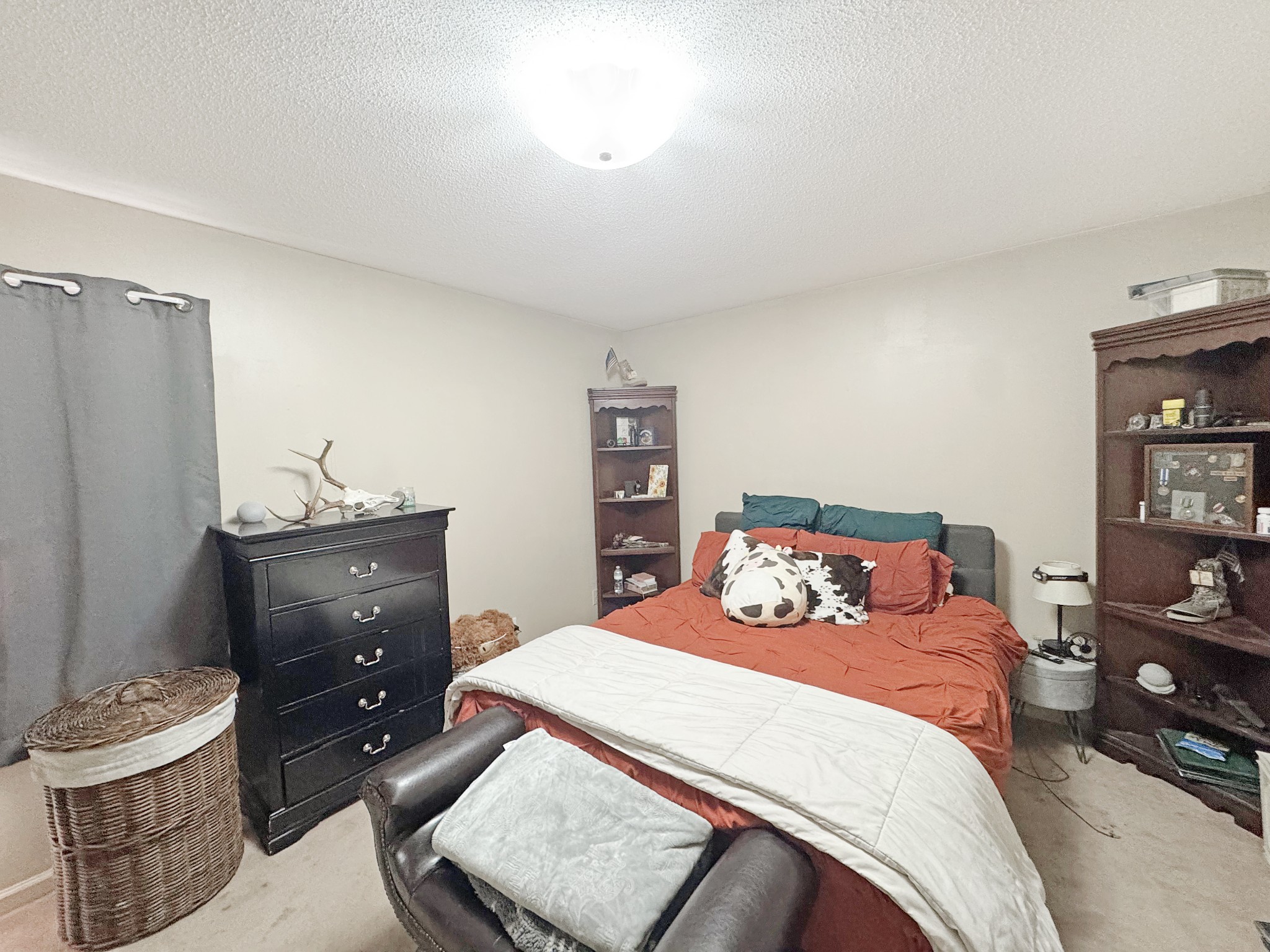 127 Lena Sykes Road Dover, TN 37058 - Photo 9 of 26 a bedroom with a bed and a night stand