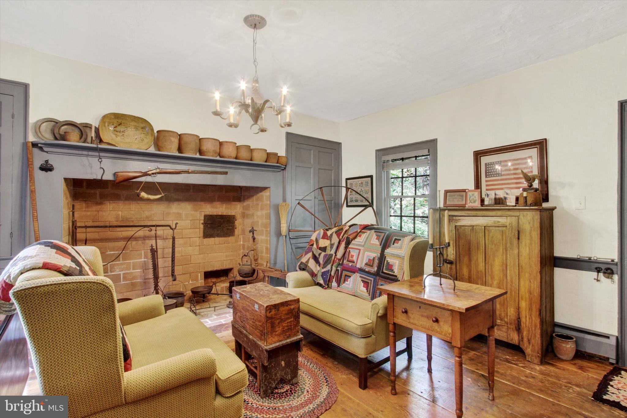 39 Kuhn Fording Road East Berlin, PA 17316 - Photo 24 of 71 a living room with furniture a chandelier and wooden floor