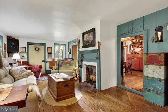 a view of a dining area with furniture and wooden floor