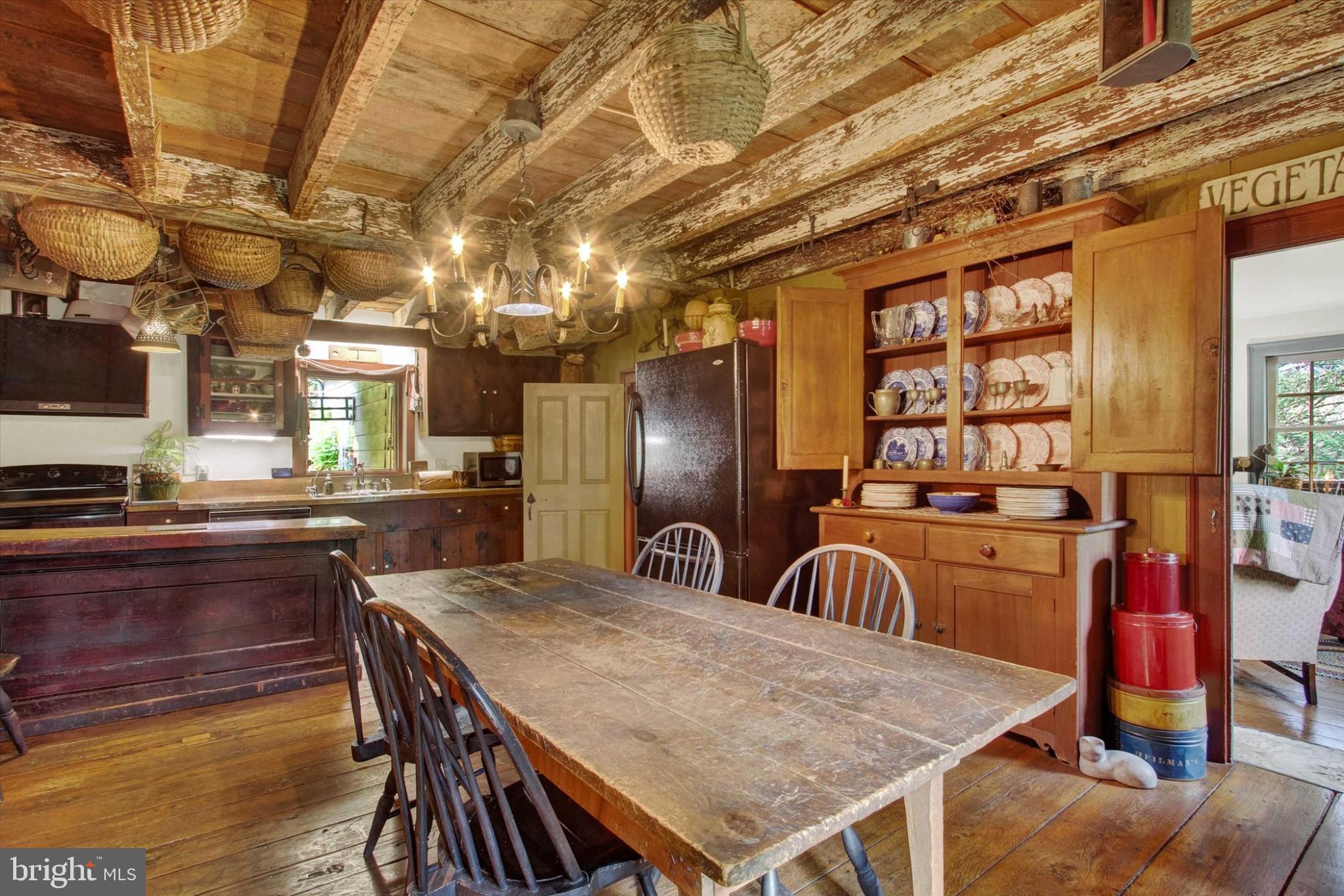 39 Kuhn Fording Road East Berlin, PA 17316 - Photo 31 of 71 a kitchen with stainless steel appliances granite countertop a table chairs and a refrigerator