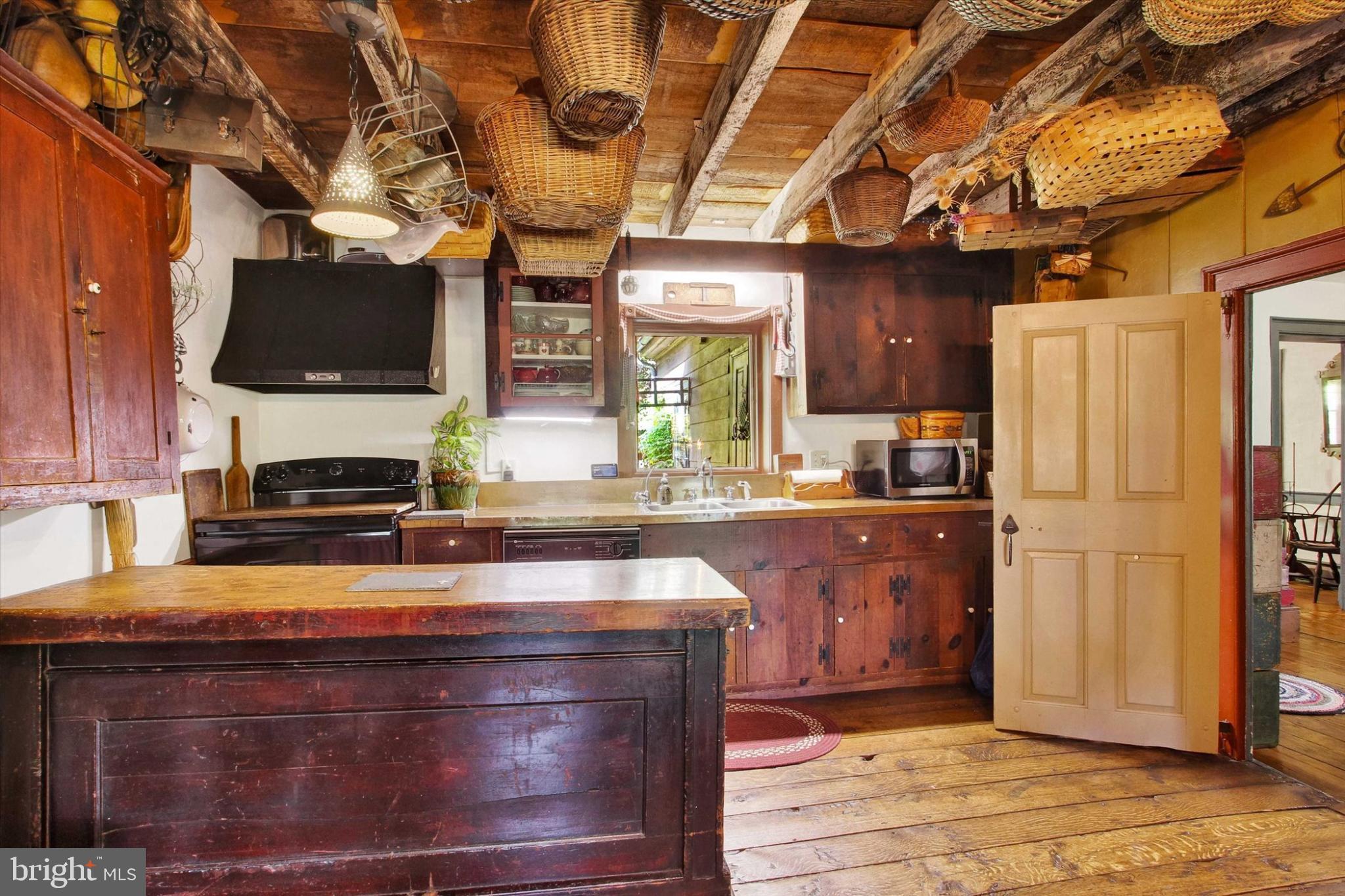 39 Kuhn Fording Road East Berlin, PA 17316 - Photo 35 of 71 a kitchen with stainless steel appliances granite countertop a stove a sink and a microwave