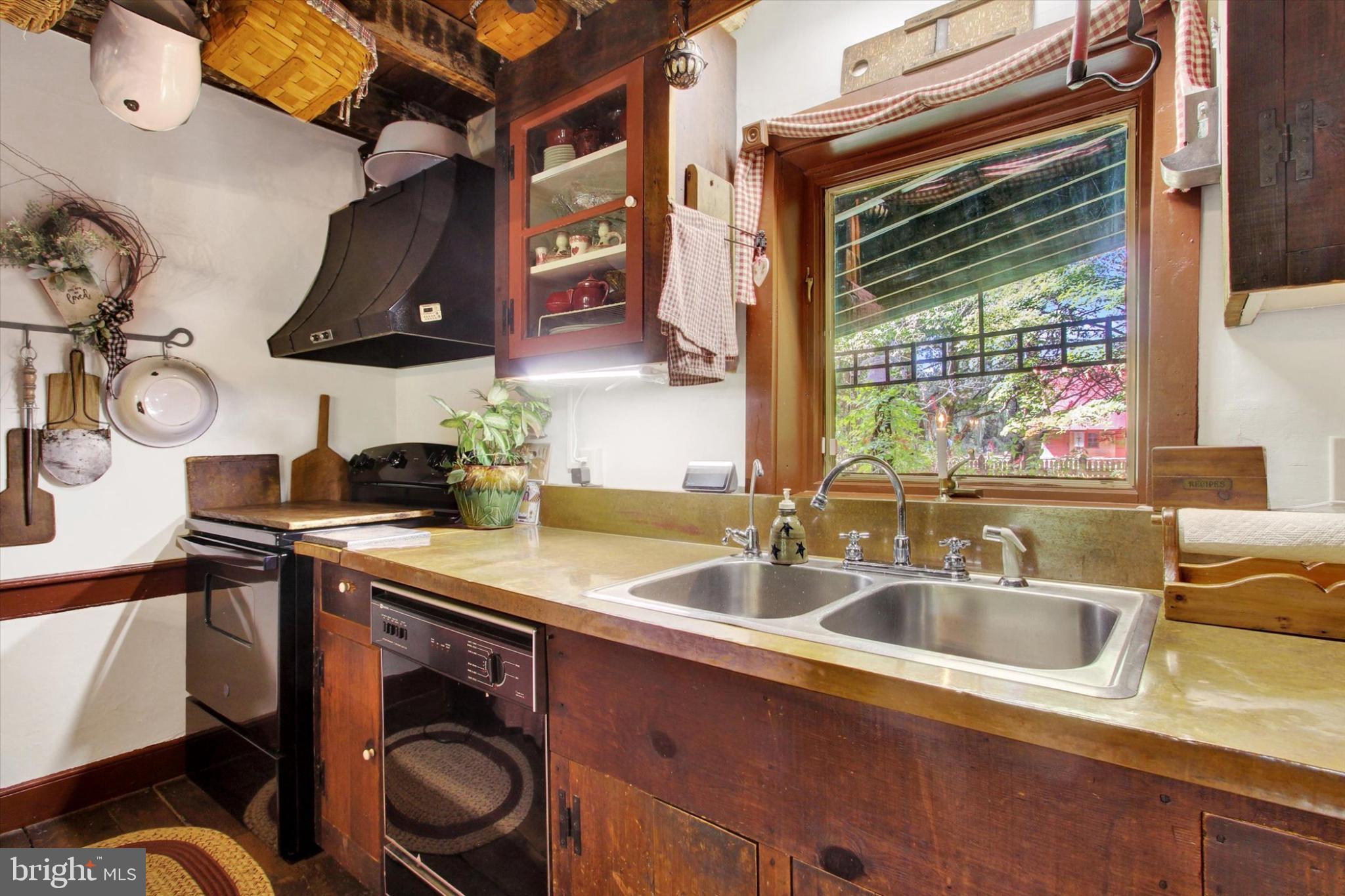 39 Kuhn Fording Road East Berlin, PA 17316 - Photo 36 of 71 a kitchen with stainless steel appliances a sink and a stove