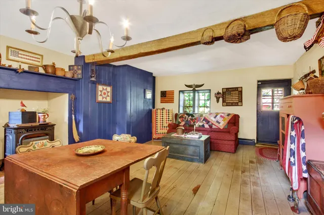 a view of a room that has a bed and a window