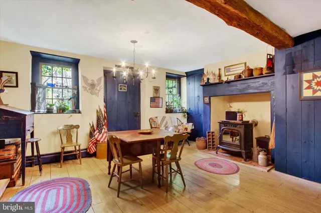 a bathroom with a sink a mirror and a window