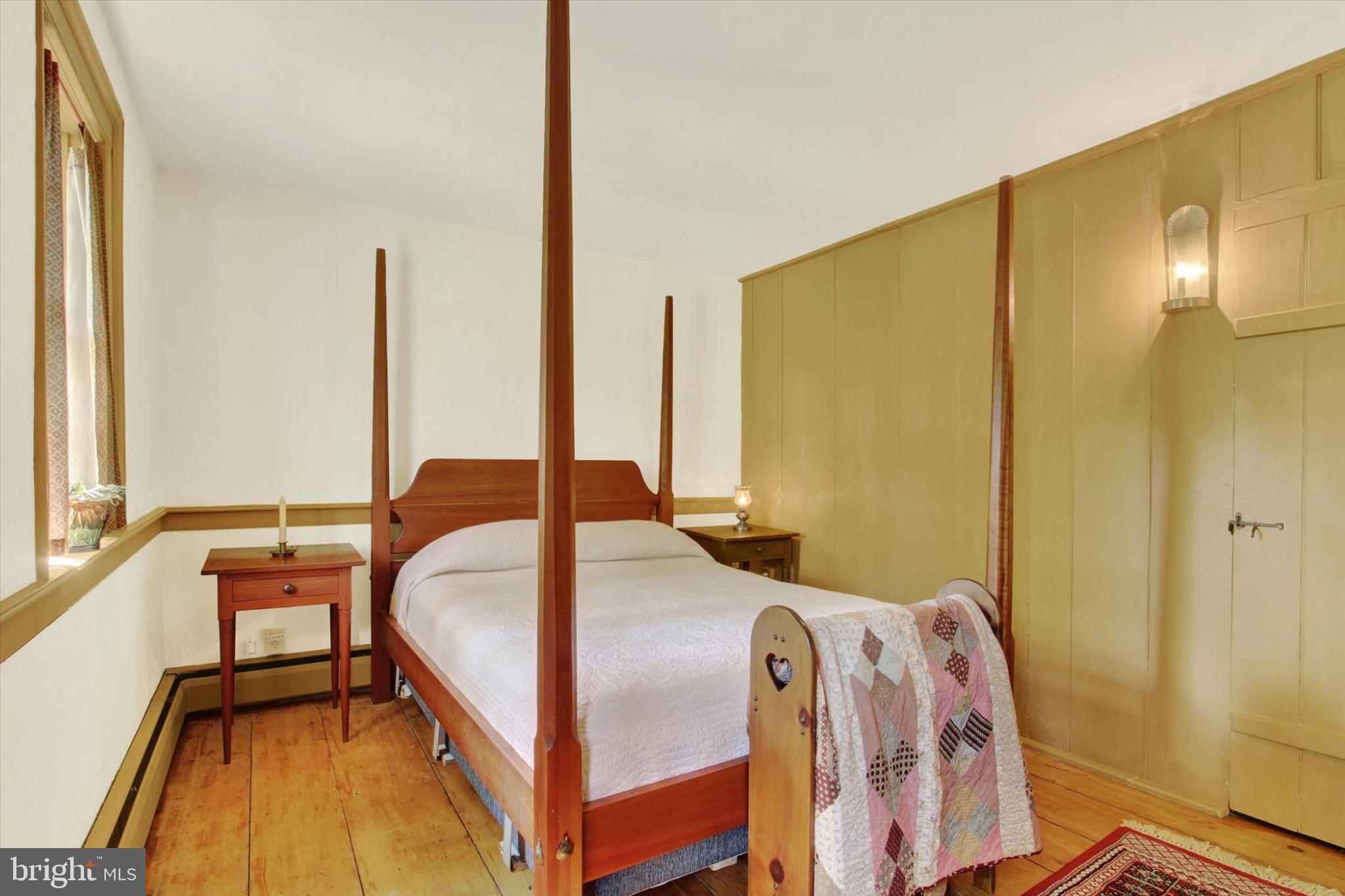 39 Kuhn Fording Road East Berlin, PA 17316 - Photo 46 of 71 a bedroom with a bed and a chandelier