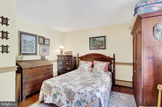 an aerial view of residential houses with outdoor space and swimming pool