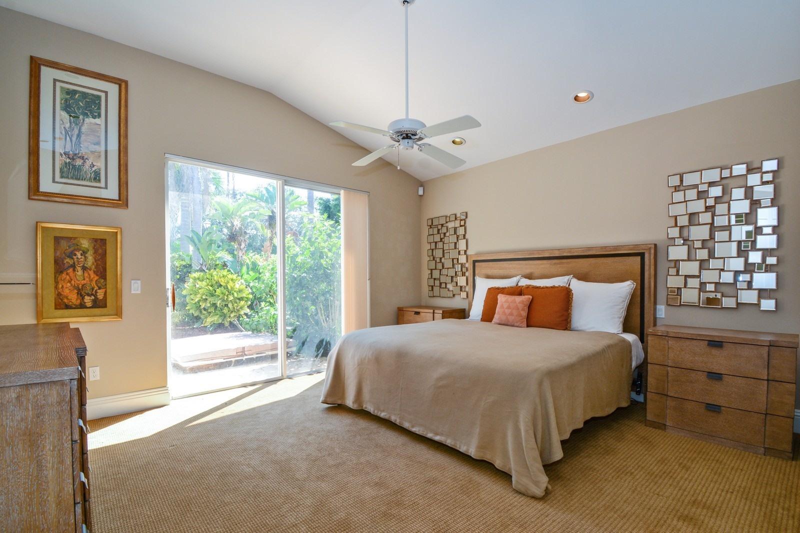5342 Northwest 26th Circle Boca Raton, FL 33496 - Photo 10 of 20 06_5342NW26thCircle_14_MasterBedroom_Cus