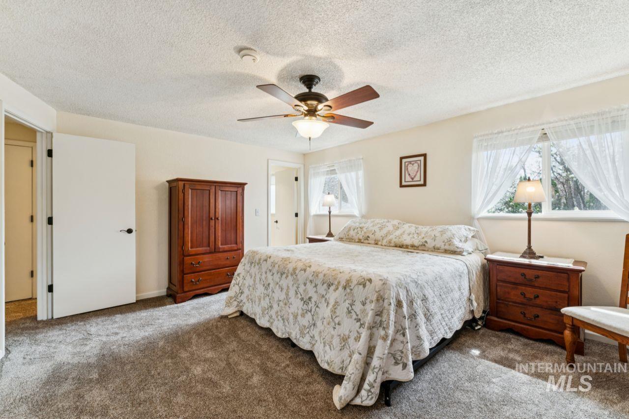 4093 North Marylebone Way Boise, ID 83713 - Photo 20 of 48 Bedroom with carpet flooring, a textured ceiling, and a ceiling fan