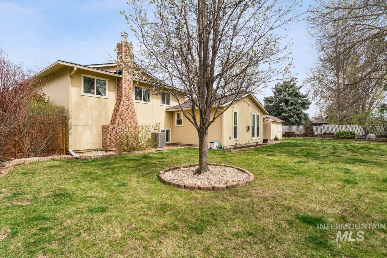 4093 North Marylebone Way Boise, ID 83713 - Photo 38 of 48 Rear view of property with a chimney