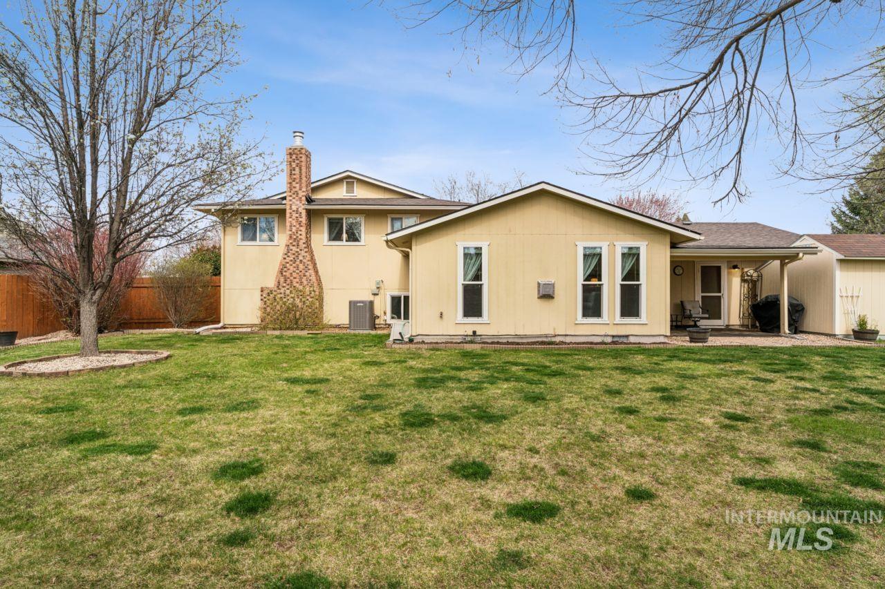 4093 North Marylebone Way Boise, ID 83713 - Photo 42 of 48 Back of property featuring a chimney and a porch