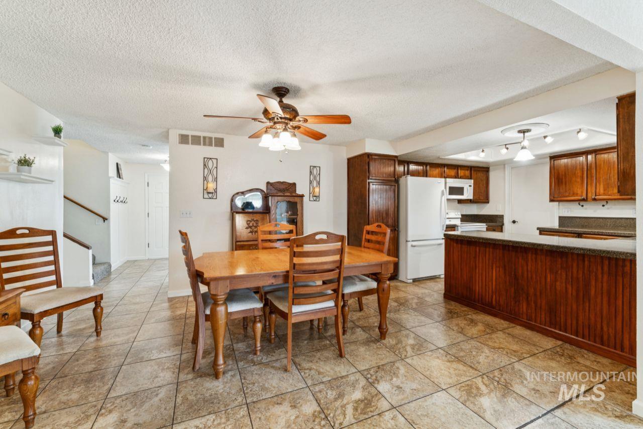 4093 North Marylebone Way Boise, ID 83713 - Photo 9 of 48 Dining area with a textured ceiling and a ceiling fan