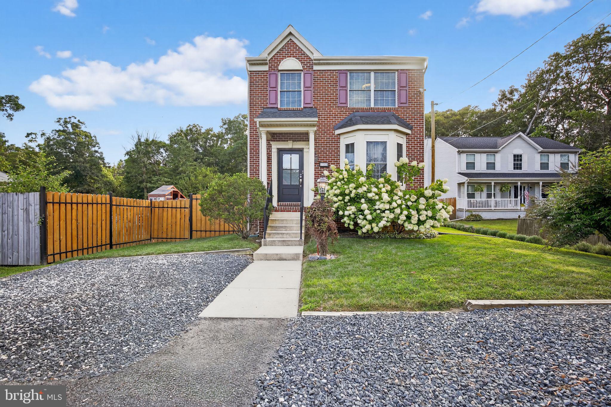 7619 North Point Road Baltimore, MD 21219 - Photo 1 of 61 a front view of a house with garden